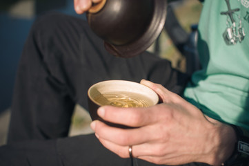 Drinking tea on the riverside in Brno, enjoying early spring sunshine