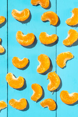 Segments of tangerine on blue background