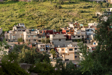Fototapeta na wymiar Poverty in Latin America, Pour houses in the hill 
