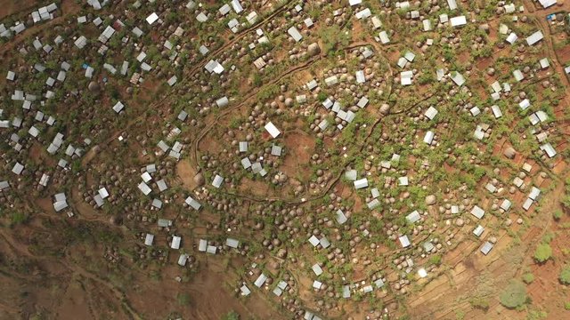 Africa rural landscapes - High angle drone flight over huts and homes made of corrugated sheet in traditional tribal village of Konso in South Ethiopia