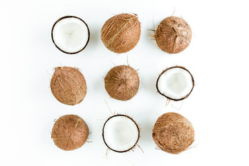Pattern, texture with coconuts on white background. Tropical abstract background. Flat lay, top view.
