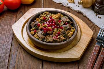 kuchmachi Georgian cuisine on wooden table