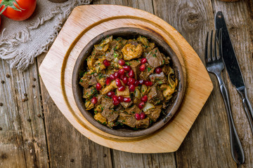 kuchmachi Georgian cuisine on wooden table
