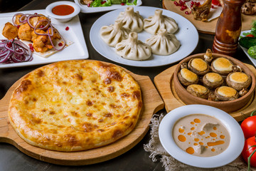 Georgian cuisine foodset from khachapuri, khinkali, pkhali, dolma, satsivi top view