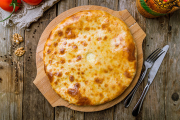 khachapuri with cheese on wooden table. Georgian cuisine