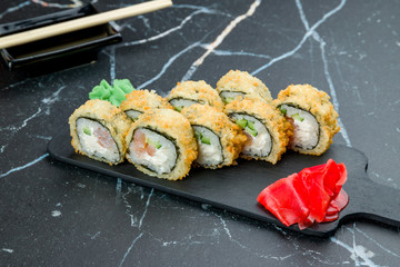 Hot roll with shrimp on dark marble table