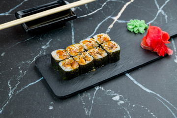 roll with eel maki on dark marble table