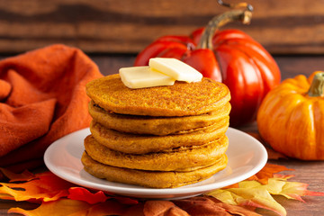 Stack of Pumpkin Spice Flavored Pancakes on a Wooden Table