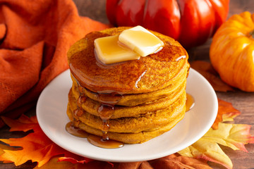 Stack of Pumpkin Spice Flavored Pancakes on a Wooden Table