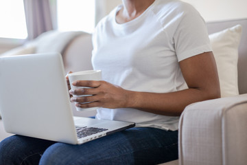 Woman at home using Laptop