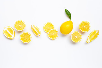 Fresh lemon with slices on white.