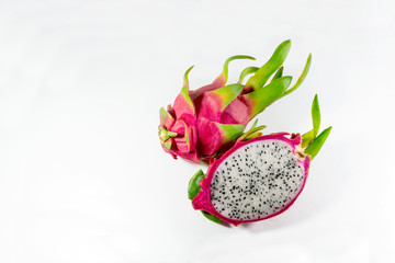 Half-cut dragon fruit placed on a white background