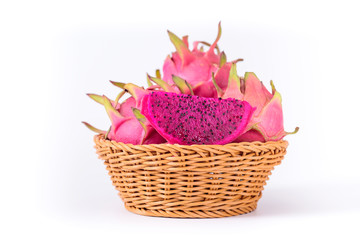 Basket of red dragon fruit isolated on white background