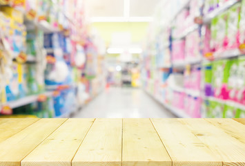 Supermarket or retail store blur background. That is a self-service shop offer grocery and variety of food, beverage and household product on shelf or rack. For shopping background or product display.