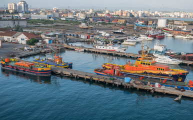 Fototapeta na wymiar Small boats docked at Durres Port.