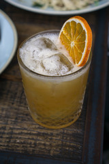 old fashioned whiskey cocktail with orange garnish