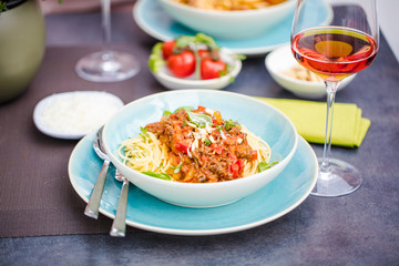 Spaghetti bolognese pasta with tomato sauce and   parmesan cheese and fresh basil