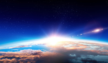 Earth with sunrise on blue space background