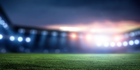 Empty night football arena in lights