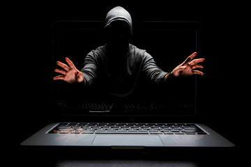 Hacker in hoodie dark theme