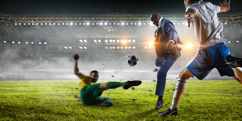 Soccer man in action with ball. Mixed media