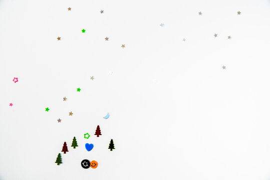 forest and sky made of glittering ornaments on a white background