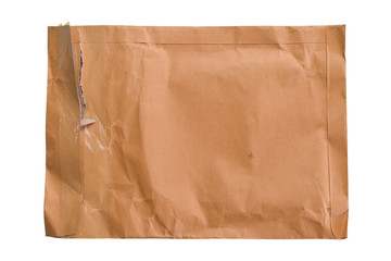 Brown torn paper envelope isolated on white background.