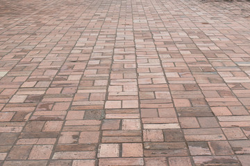 Perspective view brick stone pavement on the ground for Street Road. Vintage ground flooring square pattern texture for mock up.