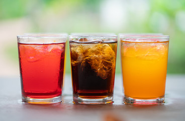 Colorful of sparkling water with ice cubes.