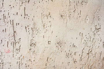 Texture of a concrete wall with cracks and scratches which can be used as a background