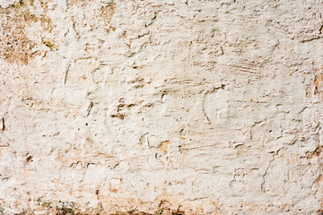 Texture of a concrete wall with cracks and scratches which can be used as a background