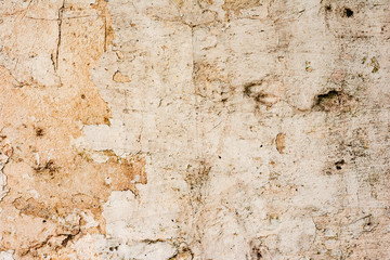 Texture of a concrete wall with cracks and scratches which can be used as a background