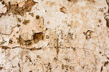 Texture of a concrete wall with cracks and scratches which can be used as a background