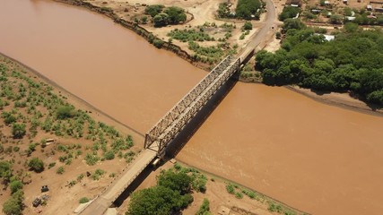 Africa infrastructure development and transportation - aerial drone shot of bridge over Omo river near border between Ethiopia and Kenya