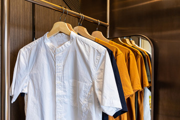 Colorful men's clothes shirts coat on hangers