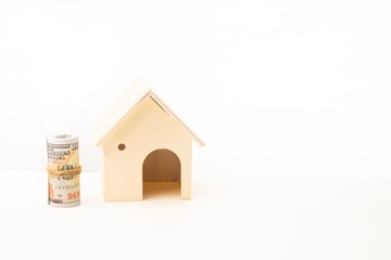 Obraz na płótnie Canvas Miniature wooden house isolated against white background 