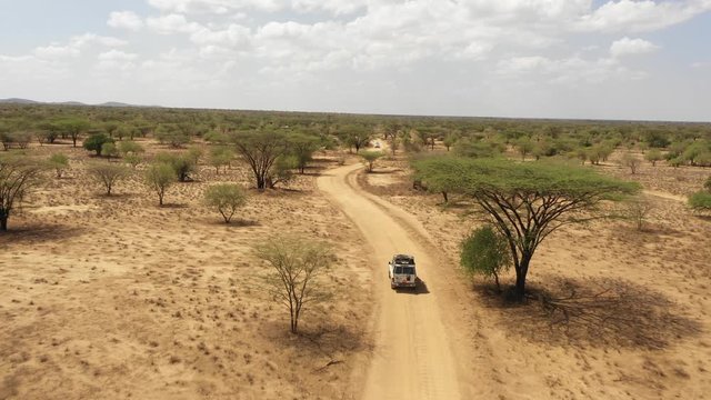 Aerial view of four wheel drive jeep in the deserts of South Ethiopia