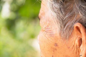 The wrinkles of the face old woman