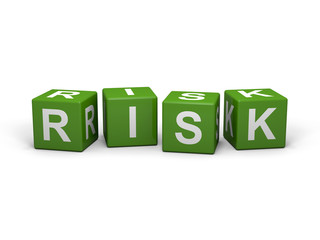 The word RISK out of green letter dices