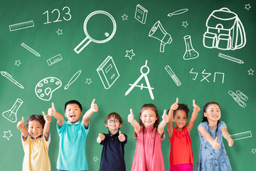 happy Multi-ethnic group of school children standing in classroom with education concept