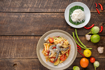 Som Tam Thai -Ingredients Papaya Salad Thai Food Style on wooden table background. Thai Food Concept. Top View