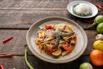 Som Tam Thai -Ingredients Papaya Salad Thai Food Style on wooden table background. Thai Food Concept. Top View