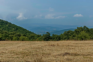 Amazing autumn view of glade, peak and forest with deciduous trees  in Sredna gora mountain, Bulgaria  