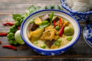 Thai food chicken green curry on dark wooden background. top view , Free space for text input
