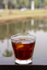 Cold Brew Coffee served in short glass with blurred background