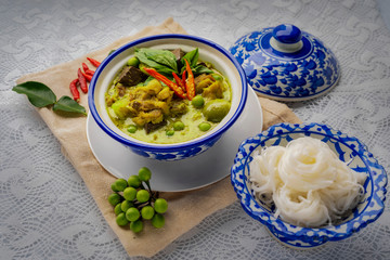 Thai food chicken green curry on dark wooden background. top view , Free space for text input