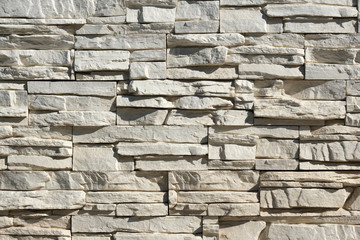 Seamless texture, background, stone lined with granite walls. sandstone. stone background wall. Facing Stone.