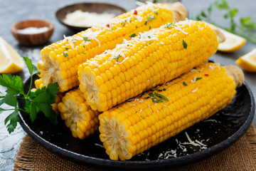 Steamed sweet corn with greens and grated parmesan.