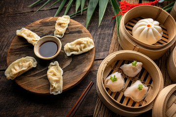 Dim sum, Dim Sum on the wooden table, top view and space for text input , Dim Sum (Chinese food) in steamed bamboo