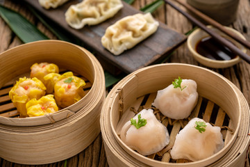 Dim sum, Dim Sum on the wooden table, top view and space for text input , Dim Sum (Chinese food) in steamed bamboo